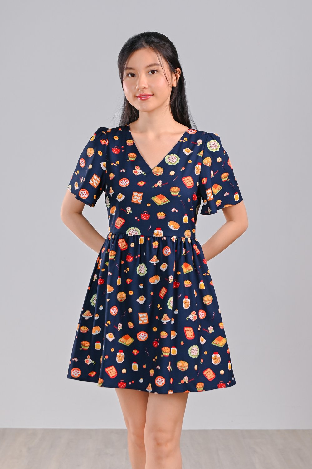 CNY SNACKS NAVY V-NECK DRESS-ROMPER