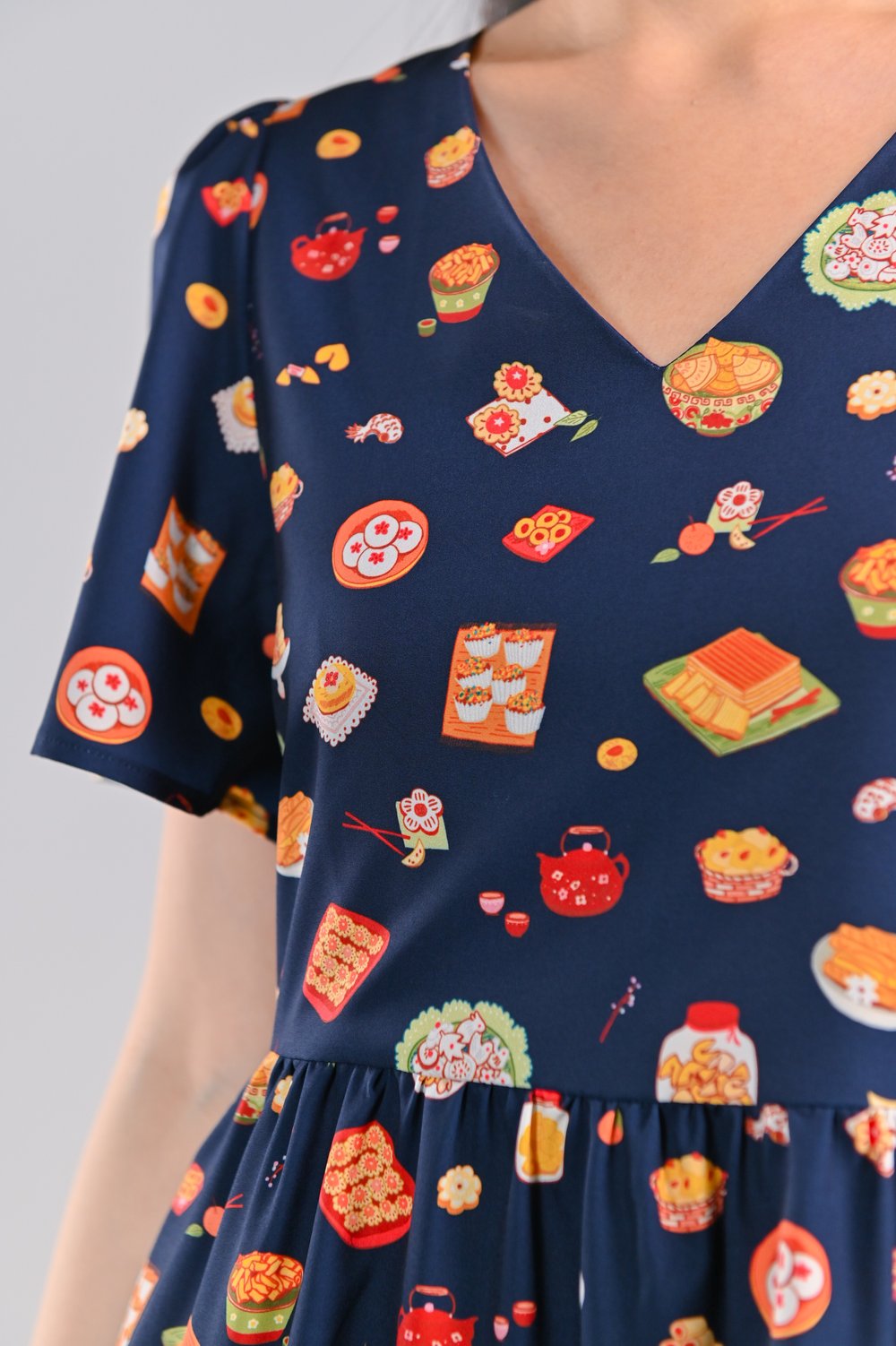 CNY SNACKS NAVY V-NECK DRESS-ROMPER