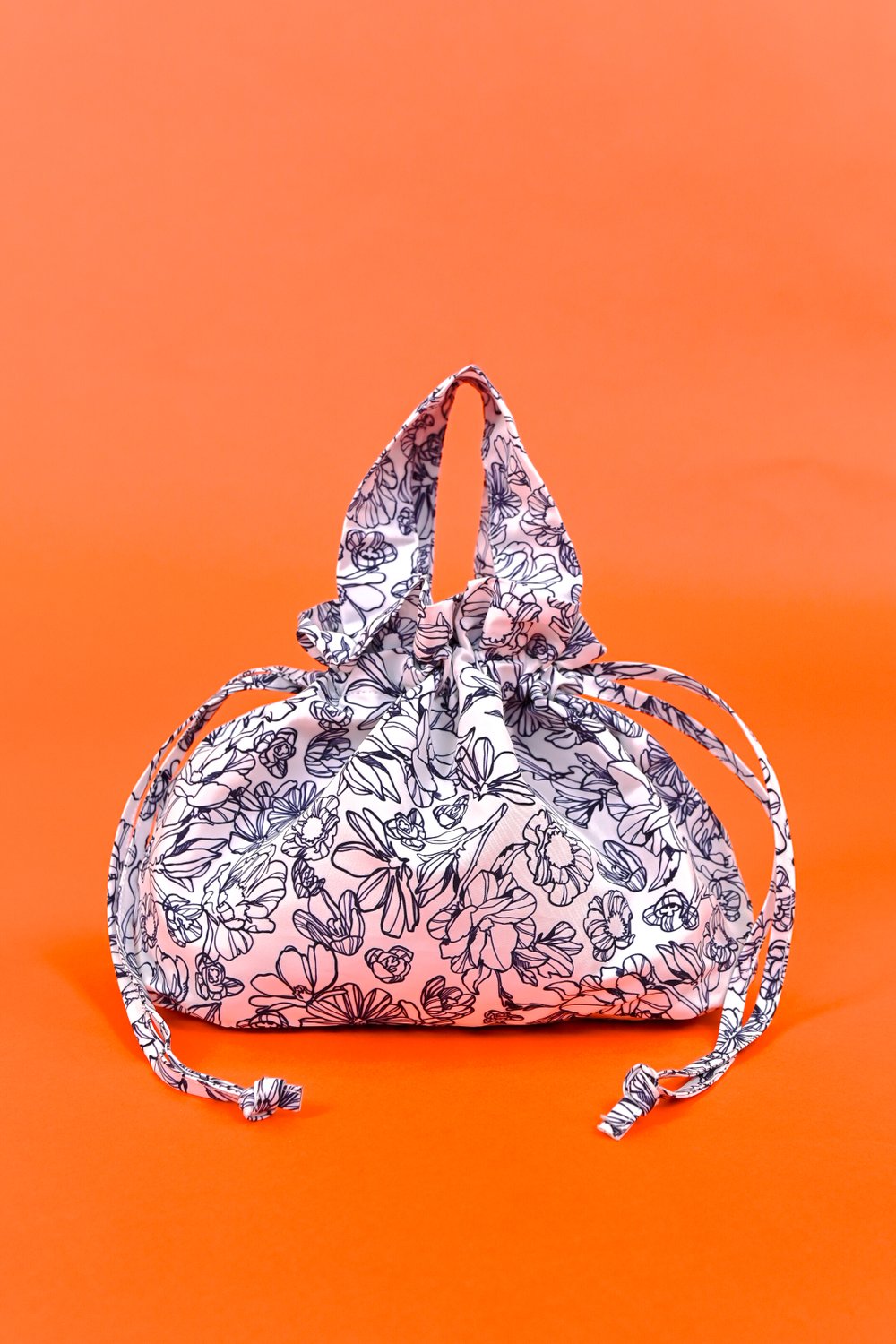 NAVY SKETCHED FLORALS DUMPLING BAG