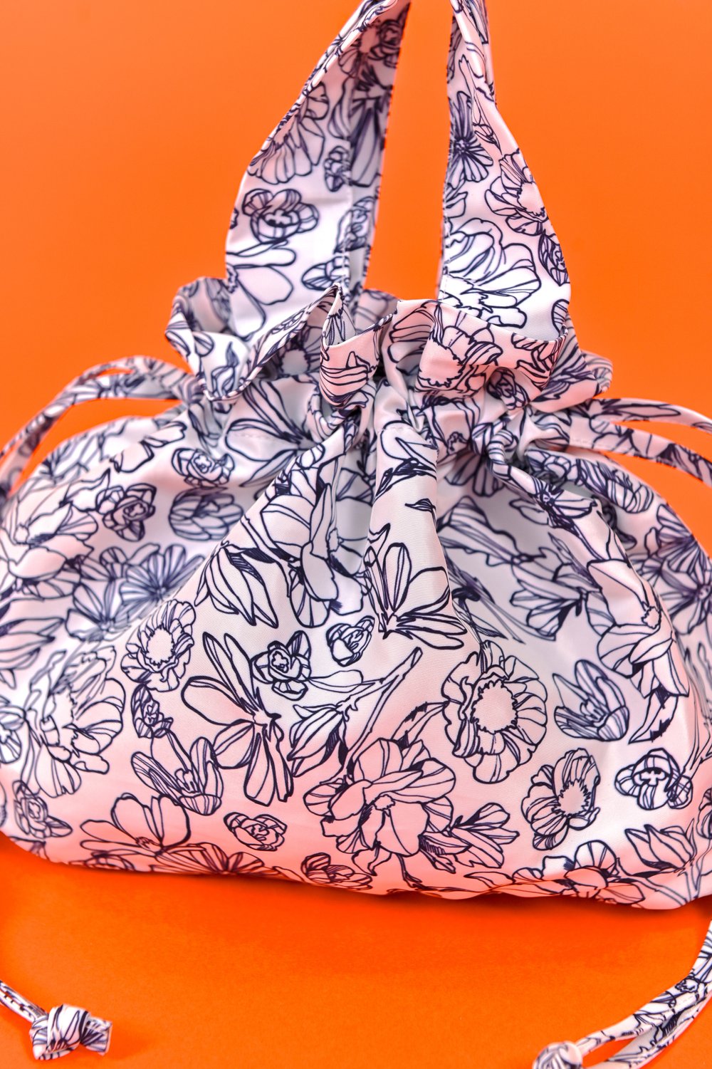 NAVY SKETCHED FLORALS DUMPLING BAG