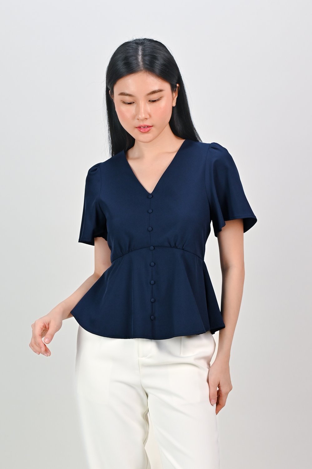 ERICA SLEEVED PEPLUM TOP IN NAVY