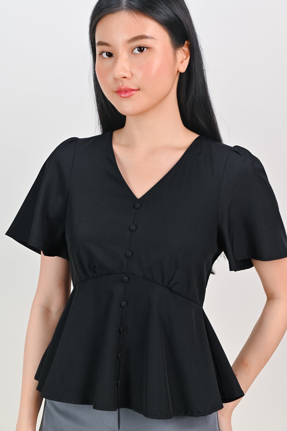 ERICA SLEEVED PEPLUM TOP IN BLACK