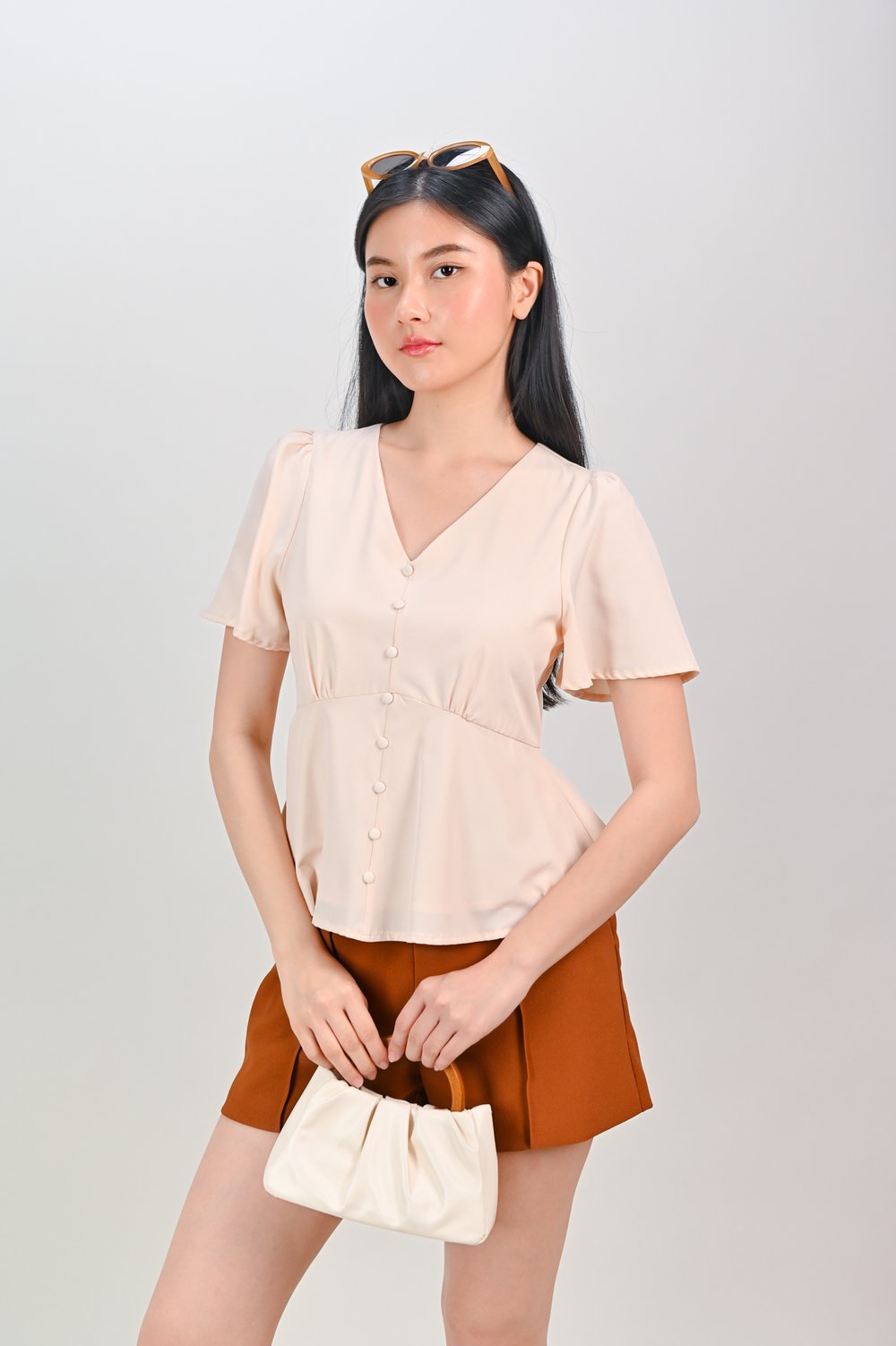 ERICA SLEEVED PEPLUM TOP IN SAND