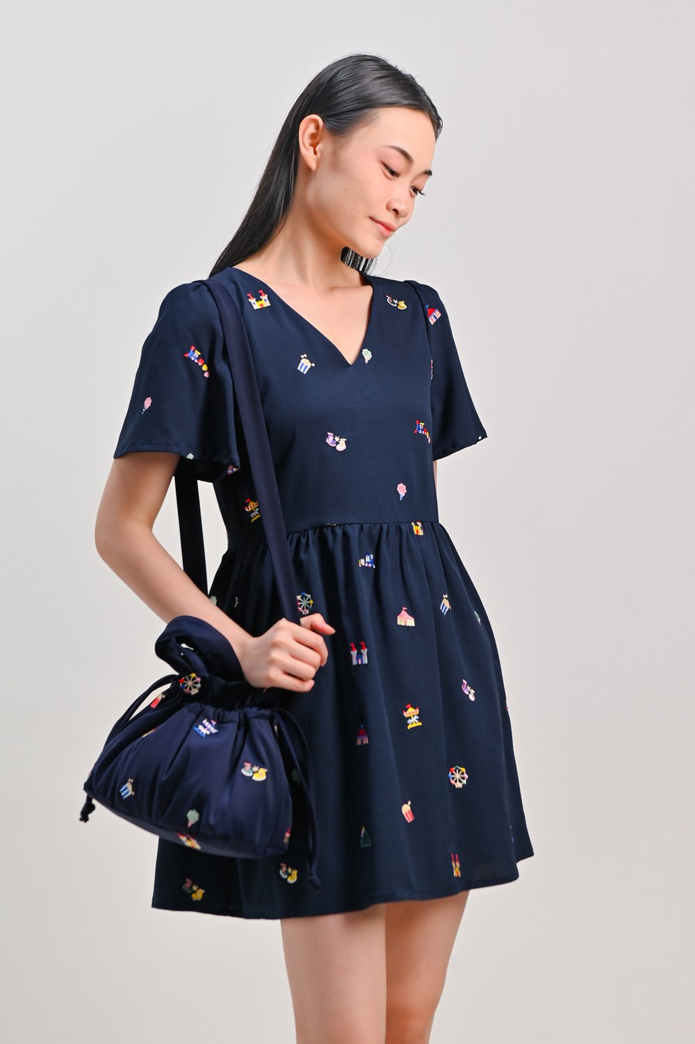 CARNIVAL NAVY EMB. PUFFY DUMPLING BAG