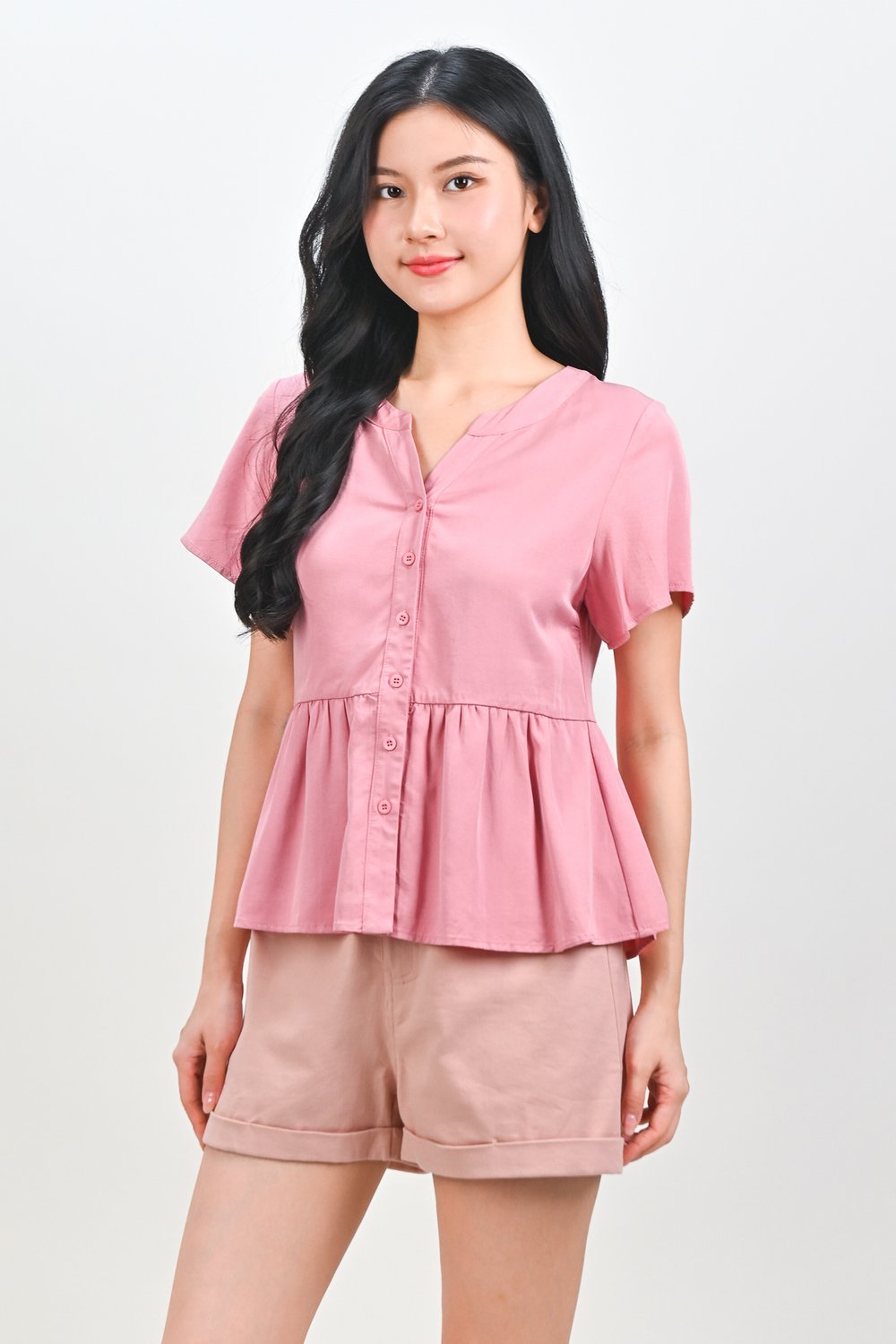 NEMIRA NOTCHED-NECK PEPLUM TOP IN PINK