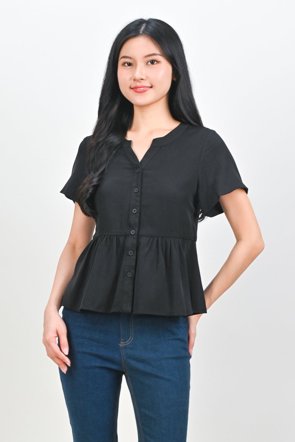NEMIRA NOTCHED-NECK PEPLUM TOP IN BLACK