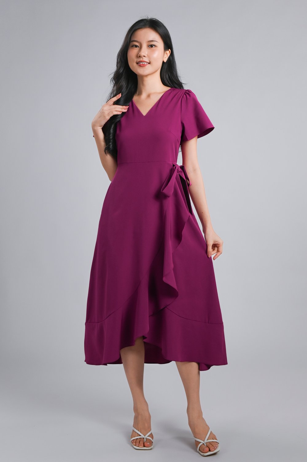 ROISIN SLEEVED FAUX-WRAP RUFFLE DRESS IN MAGENTA