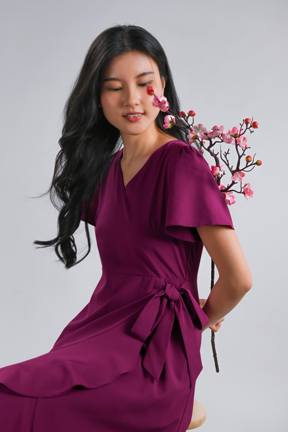 ROISIN SLEEVED FAUX-WRAP RUFFLE DRESS IN MAGENTA