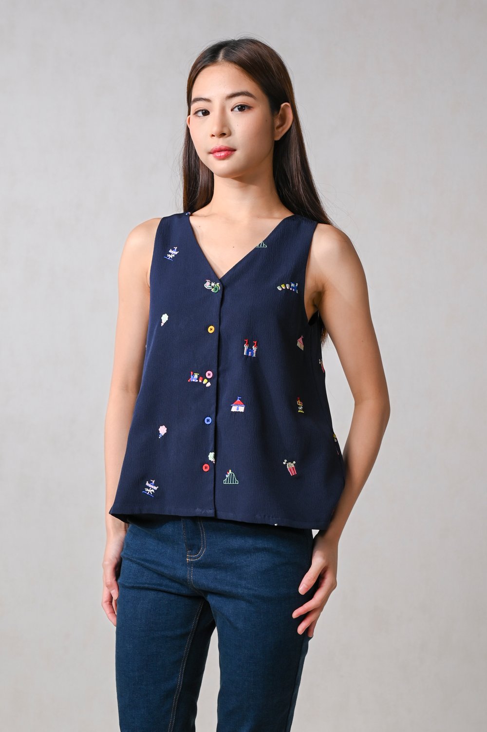 CARNIVAL NAVY EMB. TWO-WAY BUTTON TOP