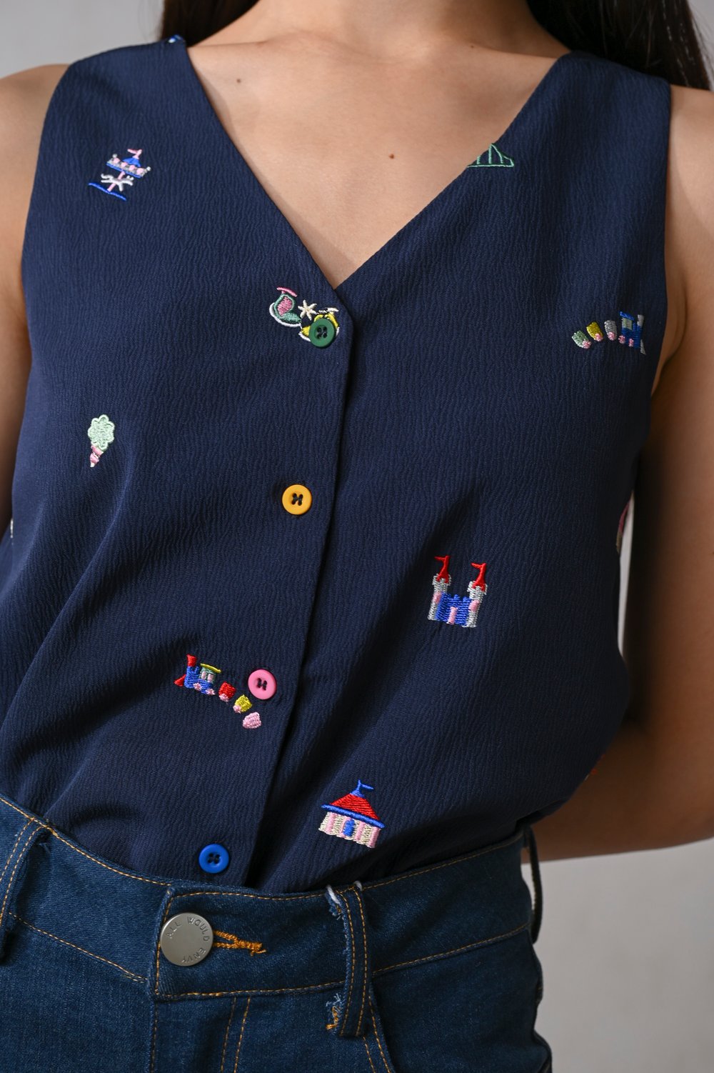 CARNIVAL NAVY EMB. TWO-WAY BUTTON TOP