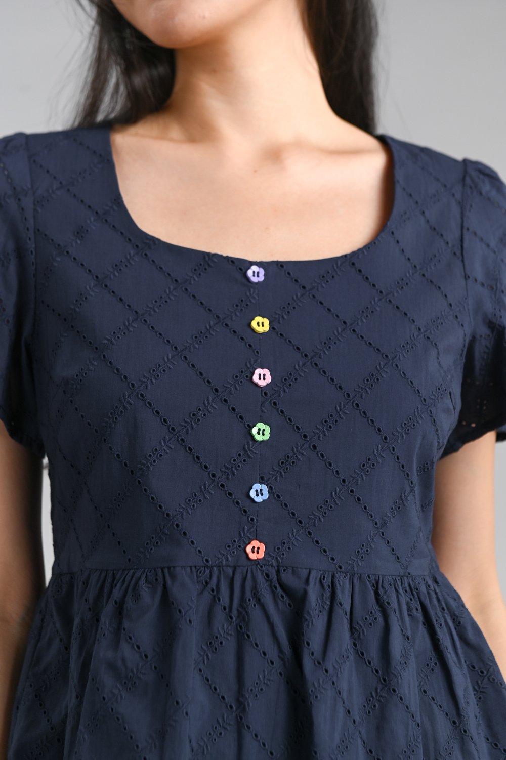 SERAPH EYELET SCOOP-NECK PEPLUM TOP IN NAVY