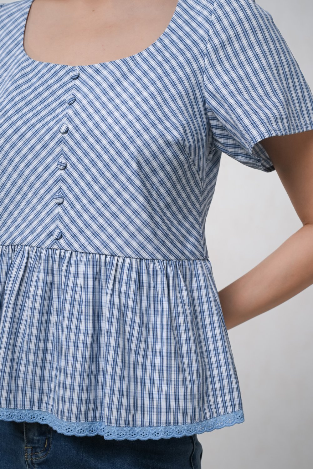 CARA PLAID PEPLUM TOP