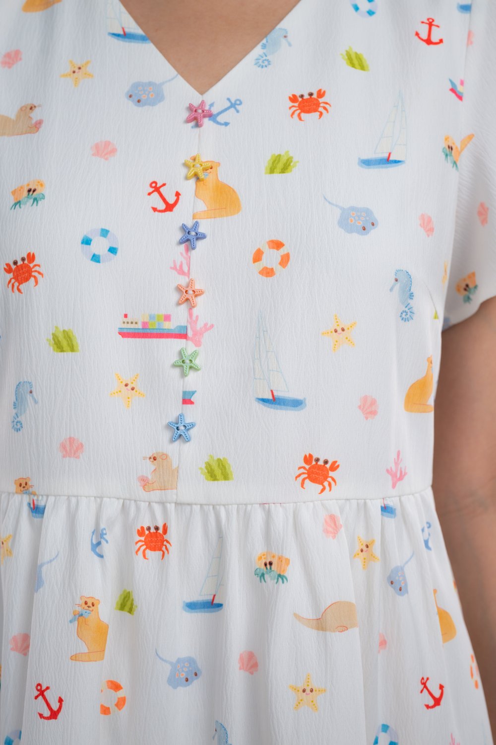 COASTAL CUTIES V-NECK BABYDOLL DRESS