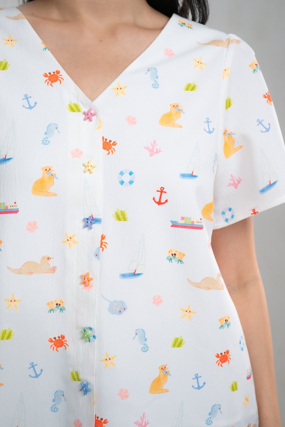 COASTAL CUTIES SLEEVED BUTTON TOP