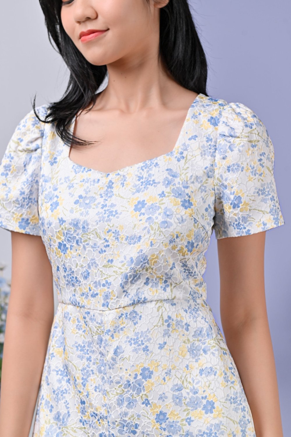 CASSIE EMBOSSED FLORAL ROMPER IN BLUE