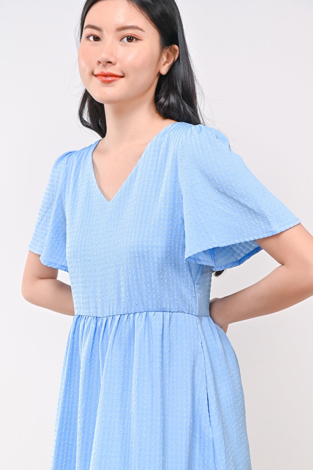 AMBER TEXTURED DRESS-ROMPER IN BLUE