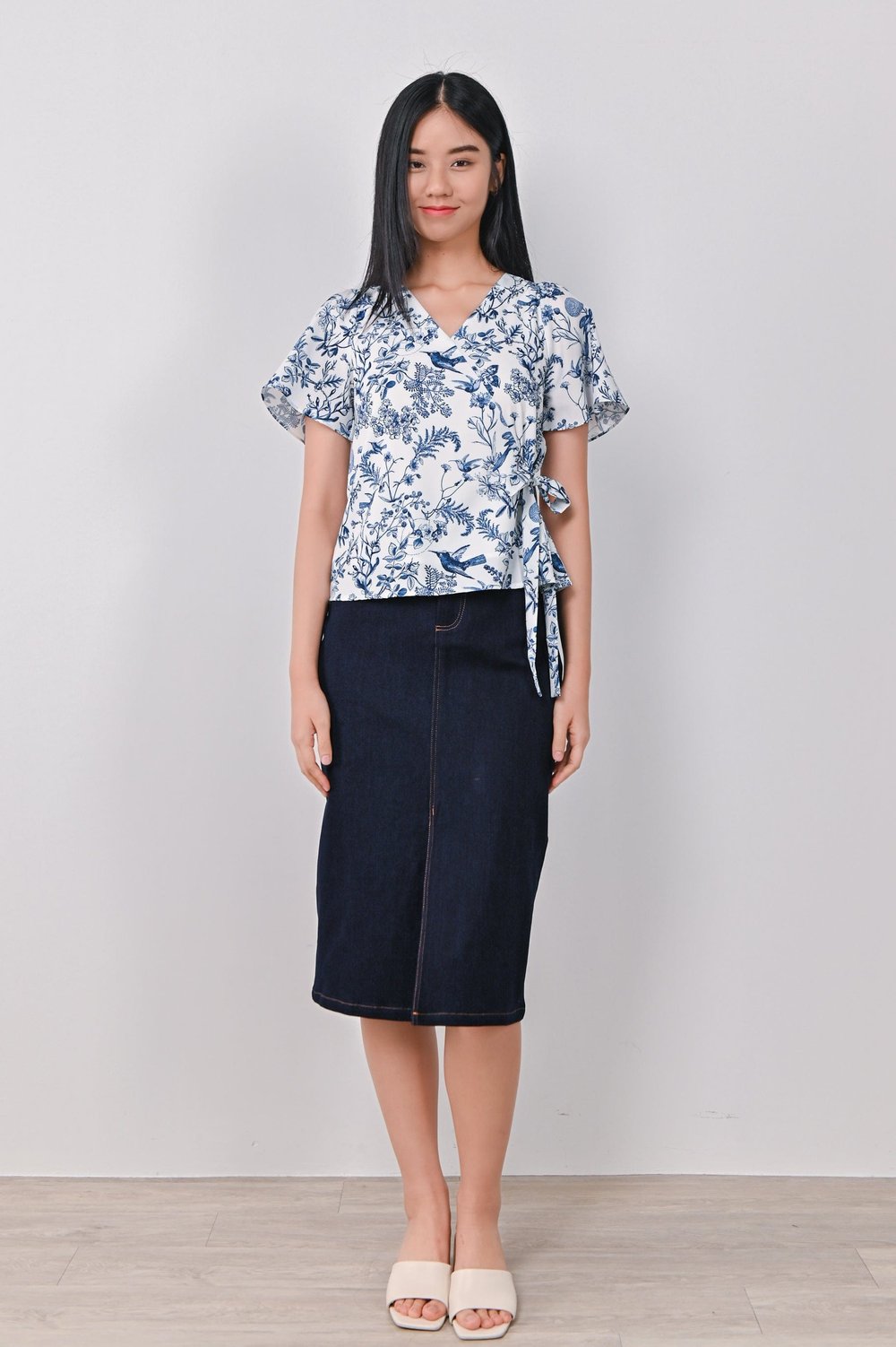 NAVY HUMMINGBIRD FAUX-WRAP TOP