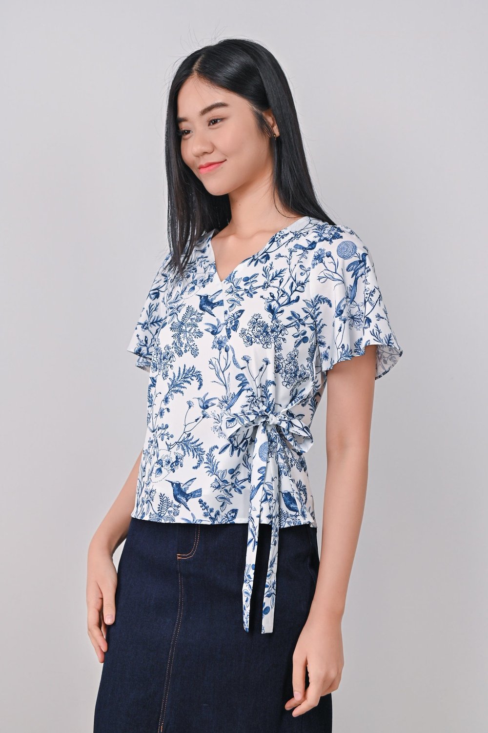 NAVY HUMMINGBIRD FAUX-WRAP TOP